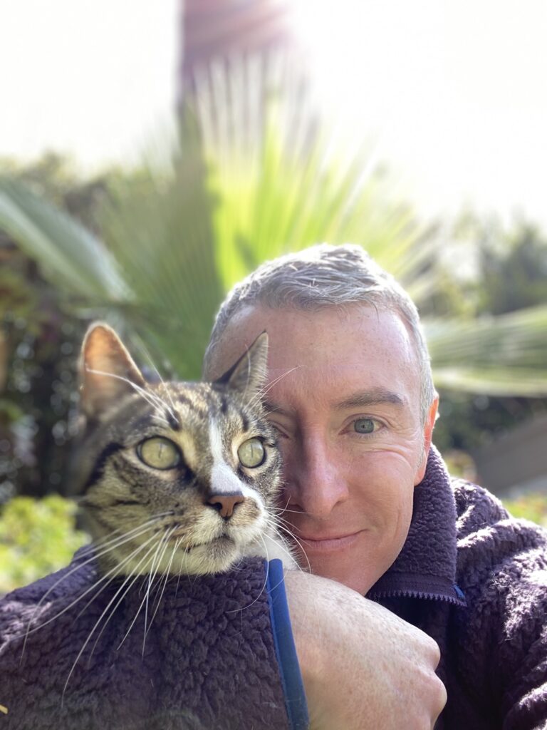 Michael R Burke holding his cat