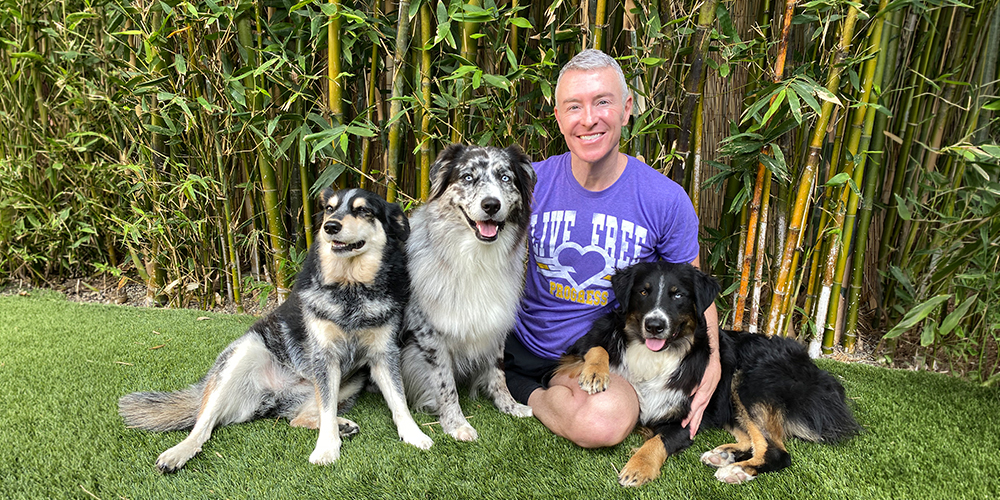 Michael Burke animal communicator with his 3 dogs