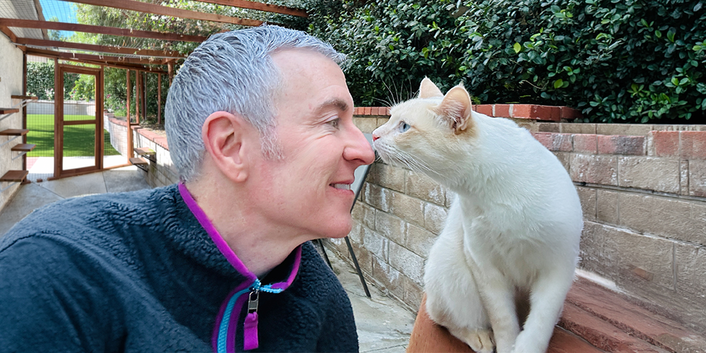 Michael Burke - animal communicator connecting with his cat