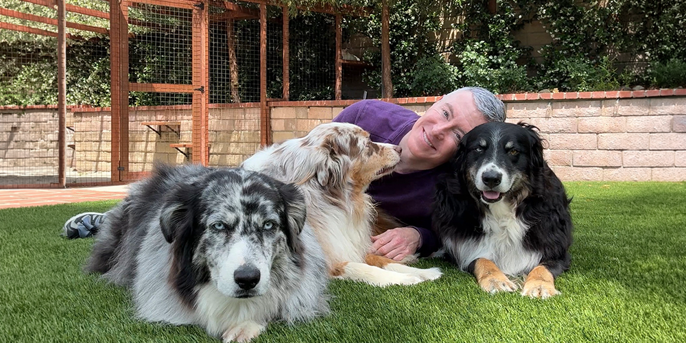 Michael R Burke connecting with his 3 dogs
